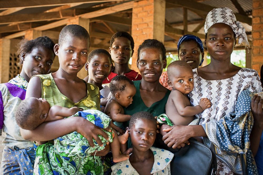 Moms holding children in home